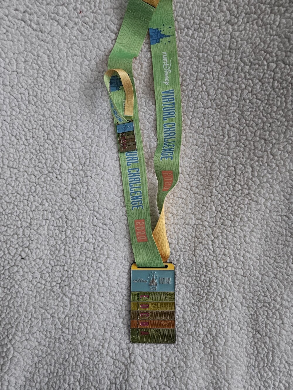 Disney green and yellow Virtual Challenge ribbon medal